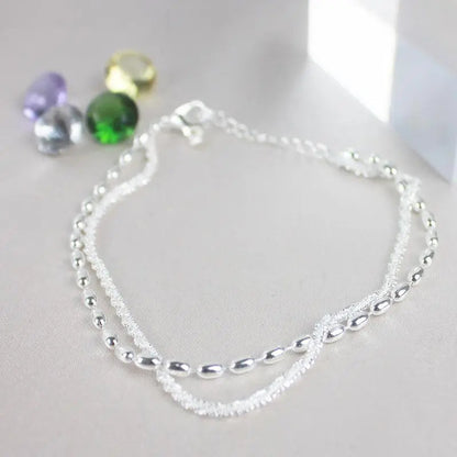 Ensemble de bracelets élégants en argent avec des pierres de zirconium
